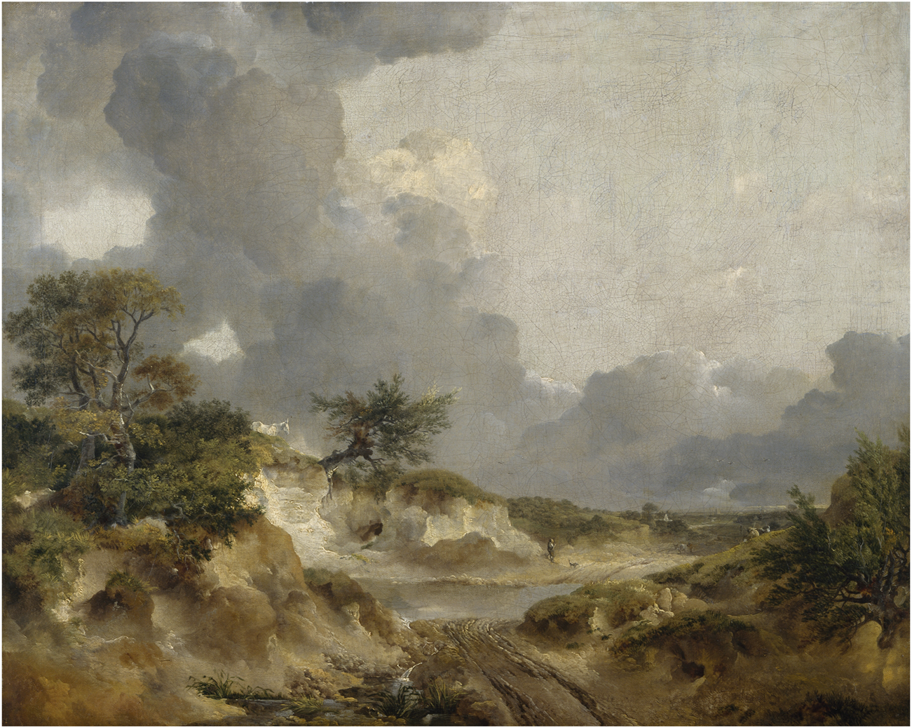 Landscape painting depicting a rural scene with dirt paths winding through sandy hills and sparse vegetation. Large, dramatic clouds fill the sky, creating a dynamic contrast with the earthy tones of the terrain.