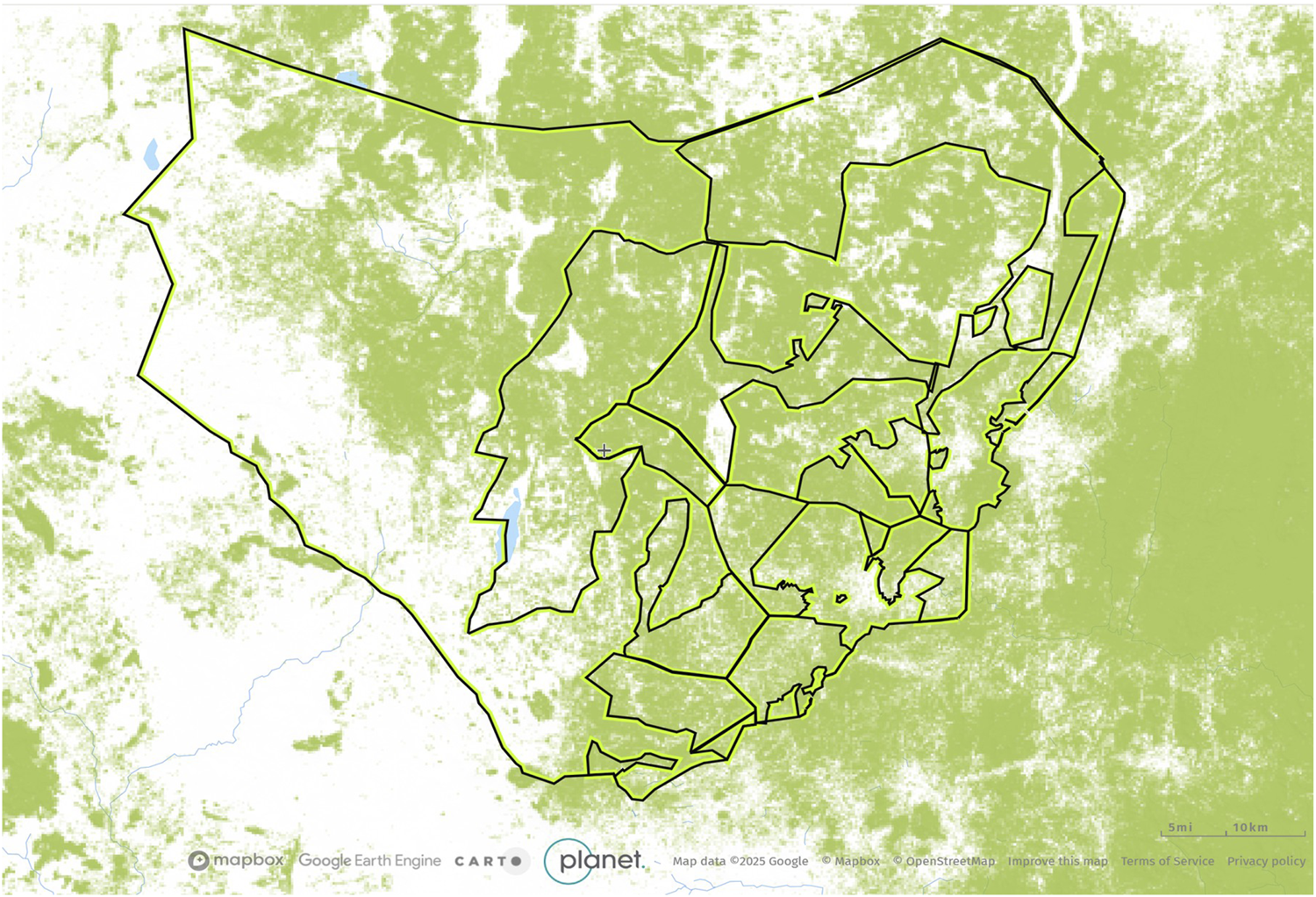 Map displaying a region with outlined boundaries overlaid on a green and white background. The map includes Designated grazing land and forest reserves within the main boundary, distinguished by black lines. Small blue areas indicate bodies of water. Logos for Mapbox, Google Earth Engine, CARTO, and Planet are visible at the bottom.