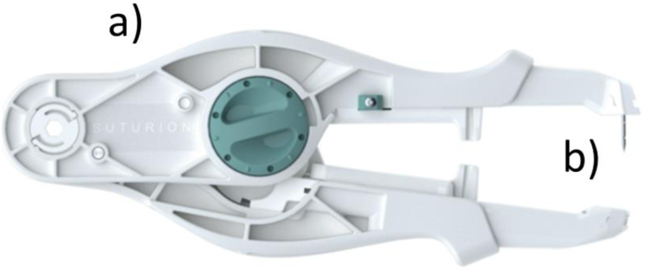 White plastic device labeled a) with teal circular component in the center, and b) showing a protruding metal needle-like point on the right side. The device appears to be related to suturing or medical applications.